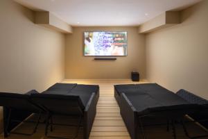 TV a/nebo společenská místnost v ubytování Greenfield Hotel Golf & Spa
