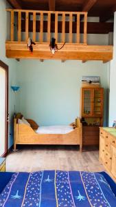 a bedroom with a bunk bed and a blue rug at Coru & Bentu in Fluminimaggiore