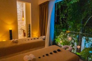 Postel nebo postele na pokoji v ubytování Olbil Hotel Boutique