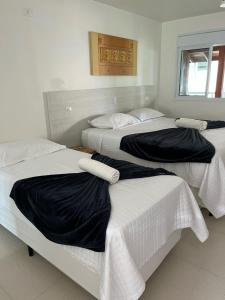 Cama ou camas em um quarto em Apart Hotel Porto Kanoas