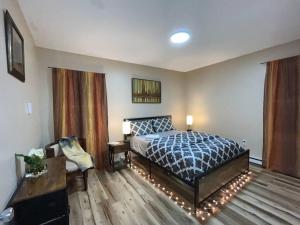 a bedroom with a bed in a room at Sauna, Games,Grill, View,Lake,Pool,TVs in Albrightsville