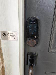 a door with a sign on it with a door knob at D & J ESTATE in Killeen