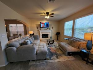 a living room with two couches and a fireplace at D & J ESTATE in Killeen