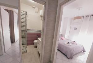 A bed or beds in a room at Butterfly Appartamento