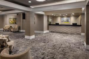 a lobby of a hotel with a waiting room at Pomeroy Hotel & Conference Centre in Grande Prairie +29 photos