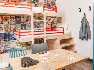 a room with a table and a bunk bed at hotelF1 Paris Porte de Châtillon in Paris