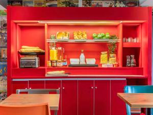 a red cabinet with some food on it at hotelF1 Paris Porte de Châtillon in Paris