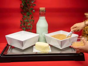 a tray of food with a bottle of milk and cheese at hotelF1 Paris Porte de Châtillon in Paris