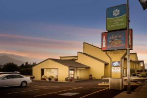 a building with a sign in a parking lot at SureStay Hotel by Best Western Wenatchee in Wenatchee