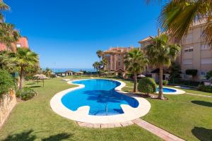 an image of a swimming pool at a resort at Apartamento Punta del Faro in Torrox Costa