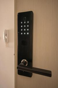 a door with a door handle and a lock on it at Vertmont Apartments in Sveti Stefan