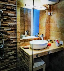 a bathroom with a large sink and a shower at Most sunny days on Gran Canaria in Puerto Rico de Gran Canaria