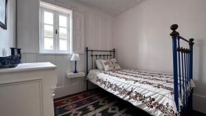 Postel nebo postele na pokoji v ubytování Palheiro da Ana