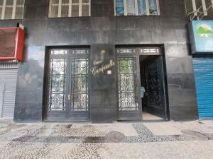 a building with two doors with a skull on it at Novíssimo APTO metrô na porta VLT Centro Rio in Rio de Janeiro