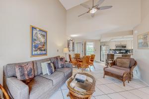 a living room with a couch and a table at Maui Banyan B204 in Wailea