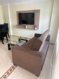 a living room with a couch and a flat screen tv at Apartamento 2 habitaciones in Barranquilla