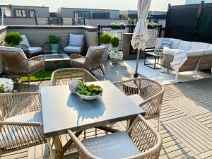 a table with a bowl of greens on a patio at Modern and Bright Luxury Home Centrally Located in Toronto’s GTA in Toronto