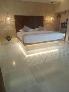Hotel Yaxactun 객실 침대