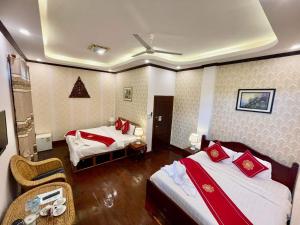 Кровать или кровати в номере Villa Phathana Royal View Hotel