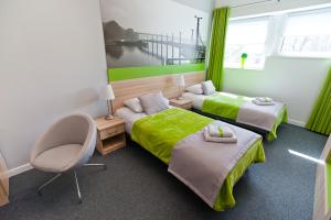 Кровать или кровати в номере Green Hotel Płock