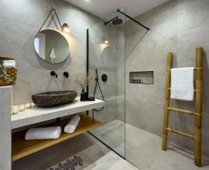 a bathroom with a sink and a shower at Aegean Balcony Studio in Áno Meriá