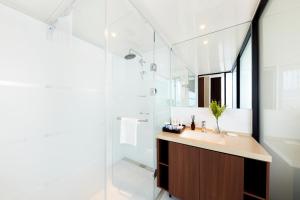 a bathroom with a sink and a shower at Pyeongtaek K-tree Hotel in Pyeongtaek