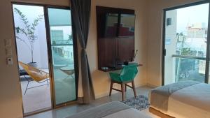 Hotel Yaxactun 객실 침대