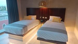 Hotel Yaxactun 객실 침대