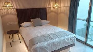 Hotel Yaxactun 객실 침대