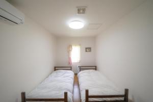 Postel nebo postele na pokoji v ubytování 小樽民泊太田1号館