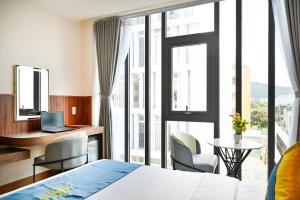 Postel nebo postele na pokoji v ubytování PLUS VUNG TAU HOTEL