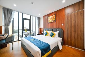 Postel nebo postele na pokoji v ubytování PLUS VUNG TAU HOTEL