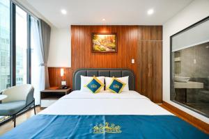 Postel nebo postele na pokoji v ubytování PLUS VUNG TAU HOTEL