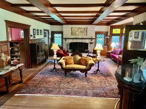 a living room with a couch and a fireplace at Manor House Inn in Norfolk