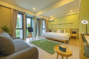 Postel nebo postele na pokoji v ubytování Chamemon Bed Phuket Town