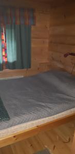 Postel nebo postele na pokoji v ubytování Pusikko