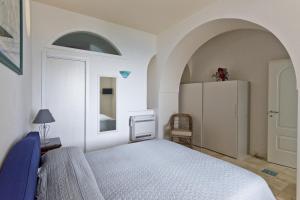 A bed or beds in a room at La Casa di Vania