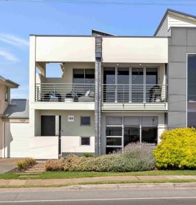 a large white house with a balcony at 180 View by Wine Coast Holiday Rentals in Aldinga Beach