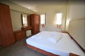 Ένα ή περισσότερα κρεβάτια σε δωμάτιο στο Anastasia Villas