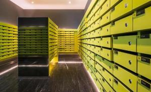 a room with yellow and green lockers in a warehouse at The BASE Central PATTAYA 2Bed on Sky in Pattaya Central