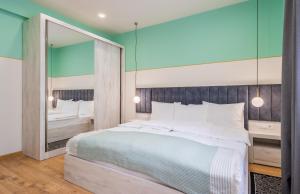 Postel nebo postele na pokoji v ubytování Devdaraki Apartments