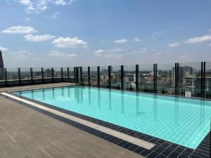 a swimming pool on the roof of a building at Sincerely Yours Suites & Serviced Apartments in Nairobi