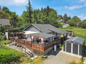 an aerial view of a house with a deck at Dragonfly Cottage in Nanaimo