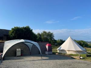 a white tent and a white tent at Glamping 4 Acres in Fryšták