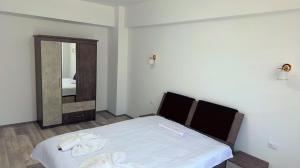 Postel nebo postele na pokoji v ubytování YES HOME ERK