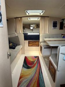 an interior view of an rv with a rug on the floor at Studio 54 Themed Boat St. Tropez in Providence