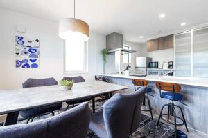 a kitchen and dining room with a table and chairs at The MOON in Sapporo