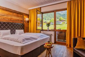 Postel nebo postele na pokoji v ubytování Landhaus Ramsau + 37 fotografií