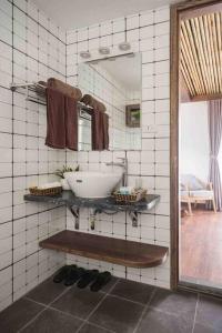 a bathroom with a sink and a mirror at HIDDEN GEM*HEART of THE OLD QUARTER*5BR*FULL HOUSE in Hanoi