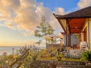 a house with a view of the ocean at Goa Giri Hill Bungalow in Nusa Penida